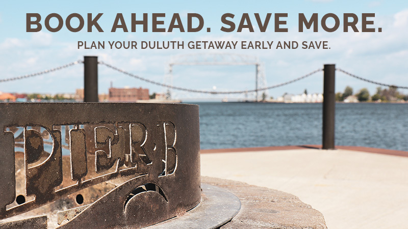 Pier B fire pit on the Duluth harbor waterfront with the Aerial Lift Bridge — Book Ahead. Save More.